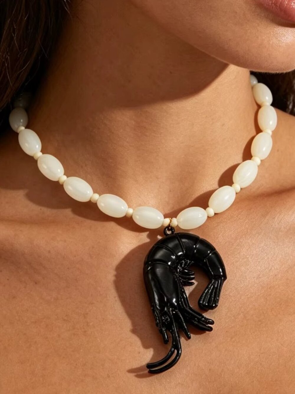 White Beaded Necklace with Black Shrimp Pendant